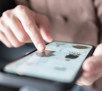 young adult showing for cloths on their phone