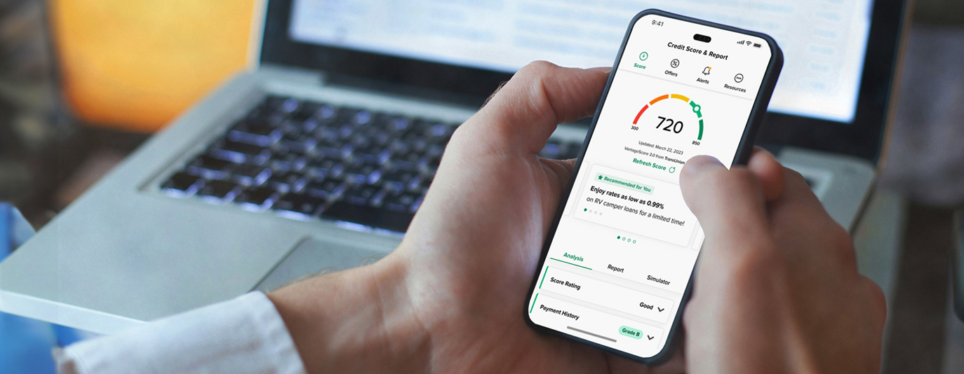 Young adult interacting with the credit score app on their phone